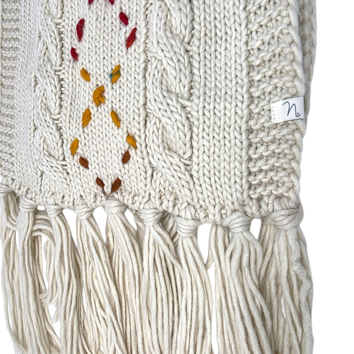 Foulard en tricot beige avec franges