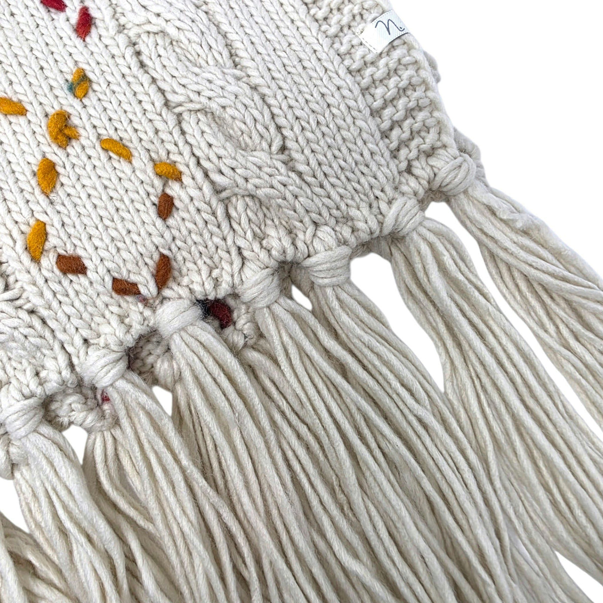 Foulard en tricot beige avec franges