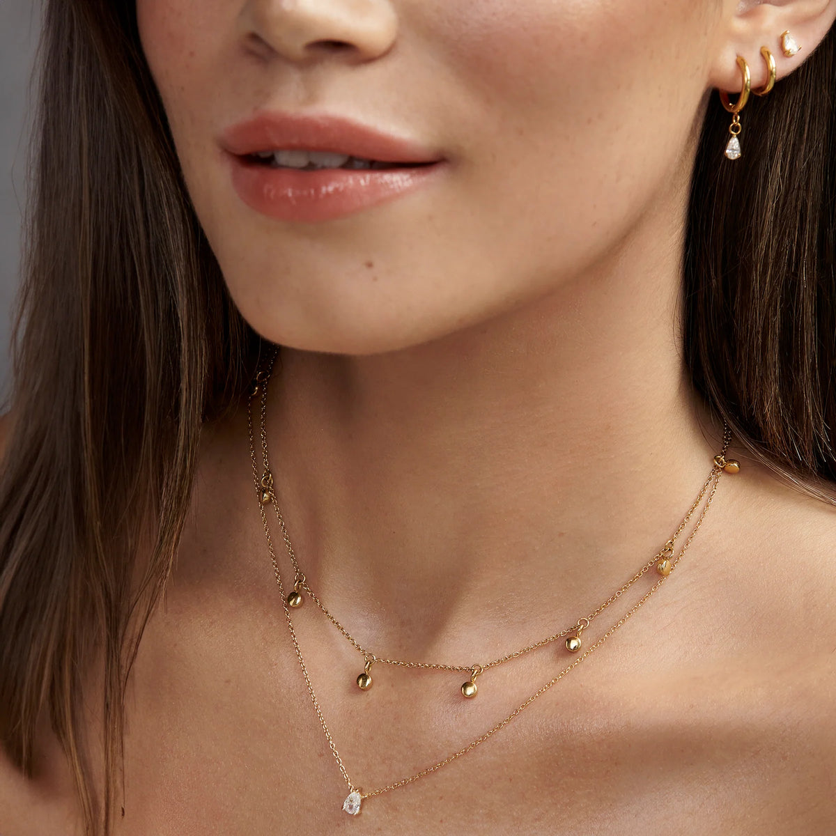 BOUCLES D'OREILLES ACIER INOXYDABLE DORE ET ZIRCON BETH II