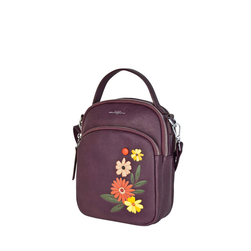 CÔTÉ DU SAC A MAIN BANDOULIERE DALIAH MAUVE ESPE AVEC DES FLEURS DALIAH ORAGNES ET JAUNES.